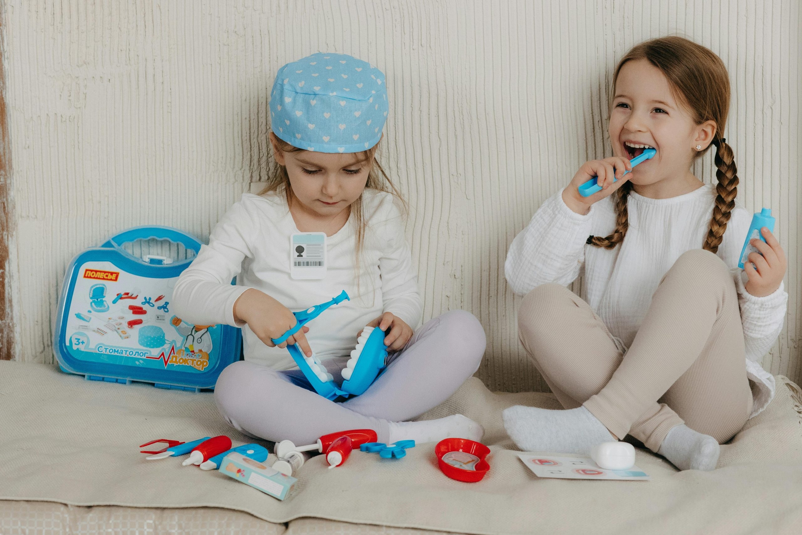 Children playing with dentist toys